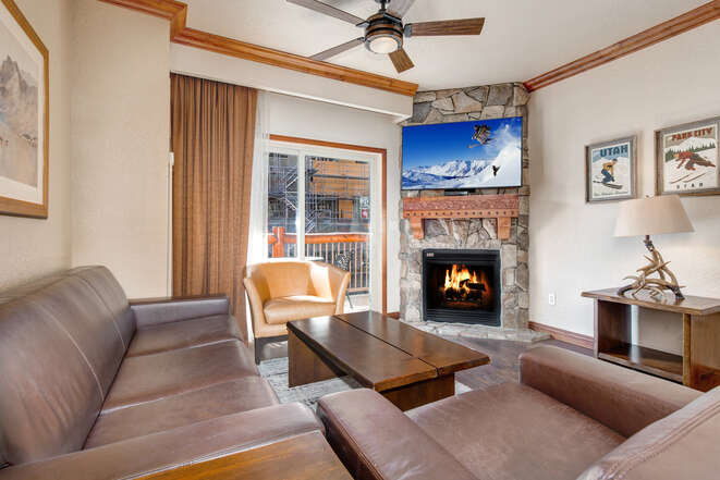 Living Room with gas fireplace, leather furnishings, 55