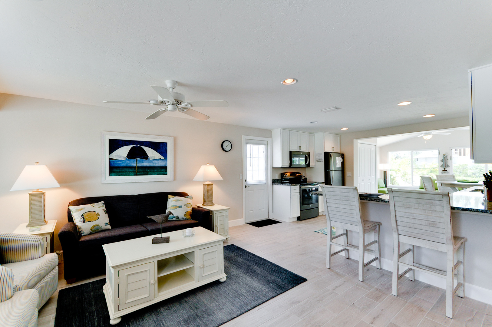 2 Pina Colada's A open concept view with living room, kitchen & dining table