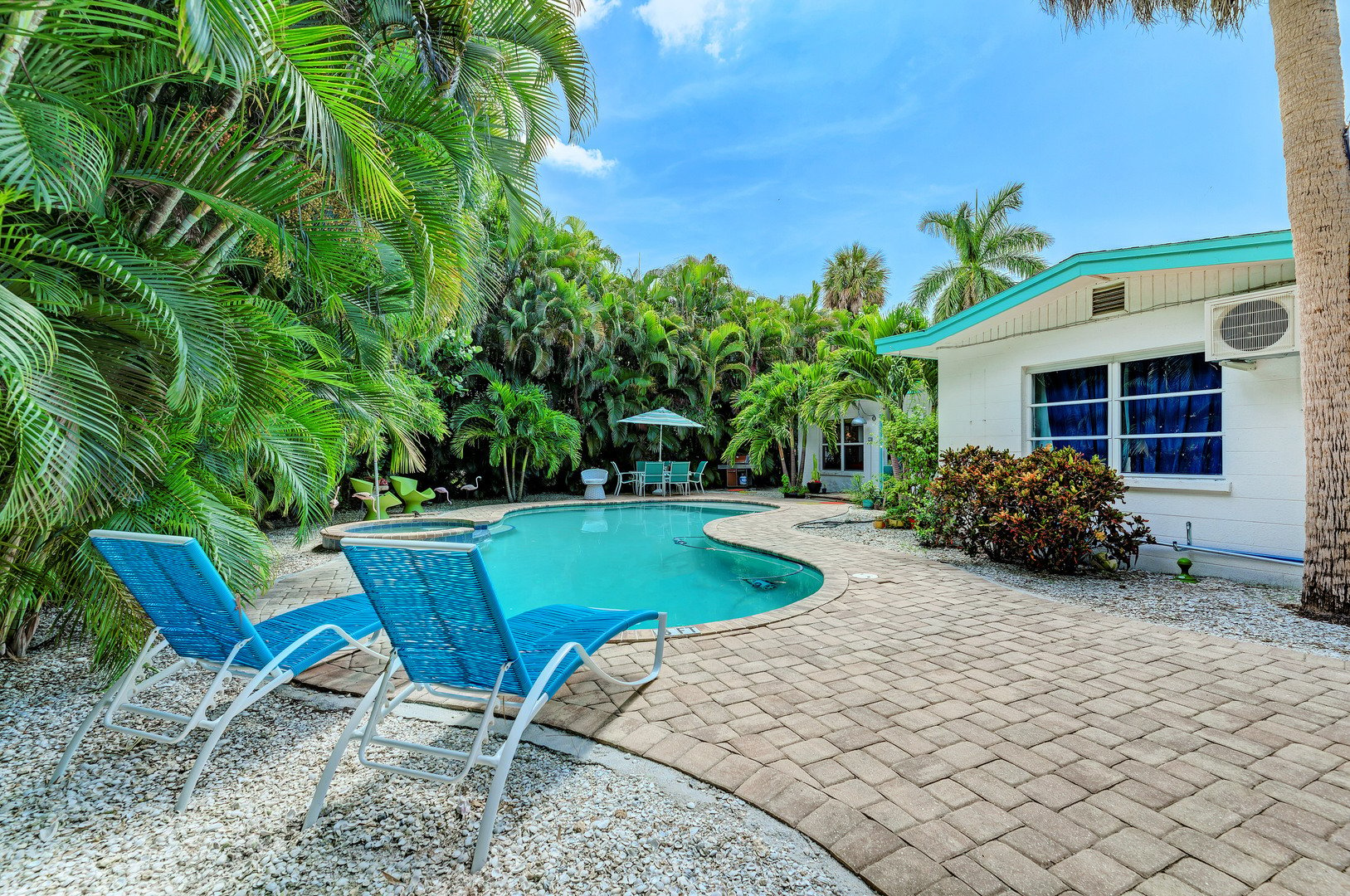 Mary Ann of Anna Maria pool pavers & loungers