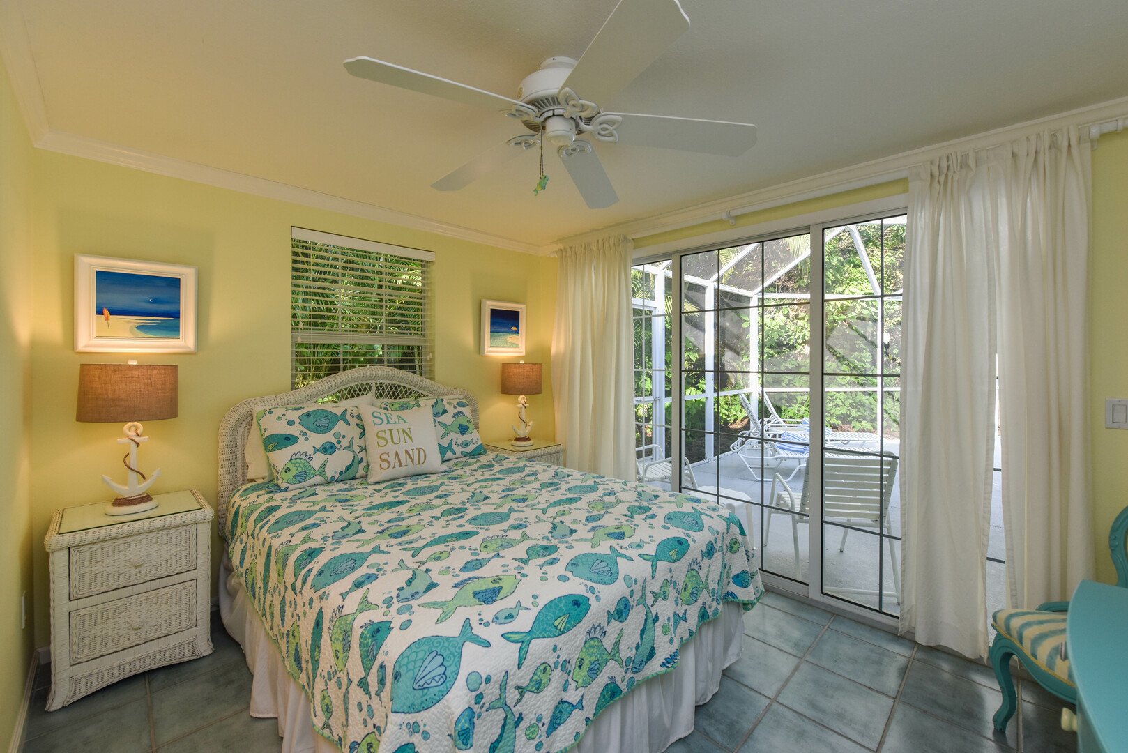 Rest Assured guest bedroom view from doorway with slider door access to pool area