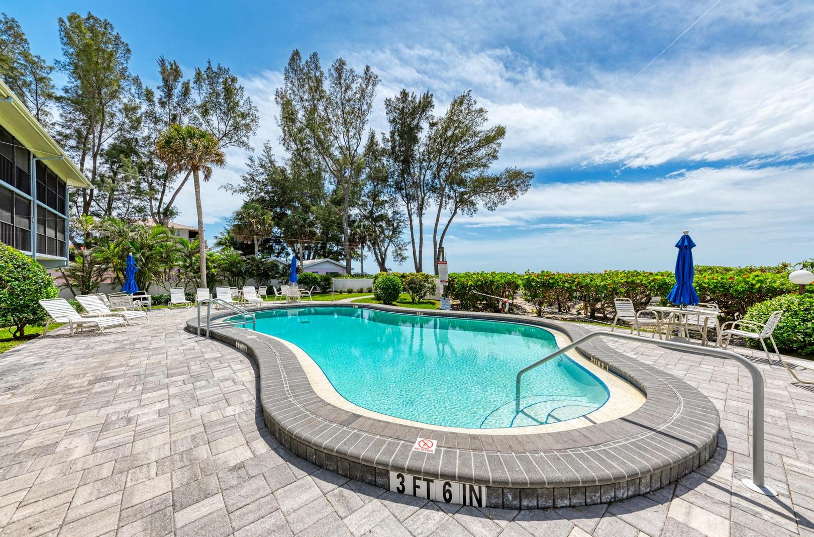 Sunset Beach 102 condo shared pool view towards the Gulf coast