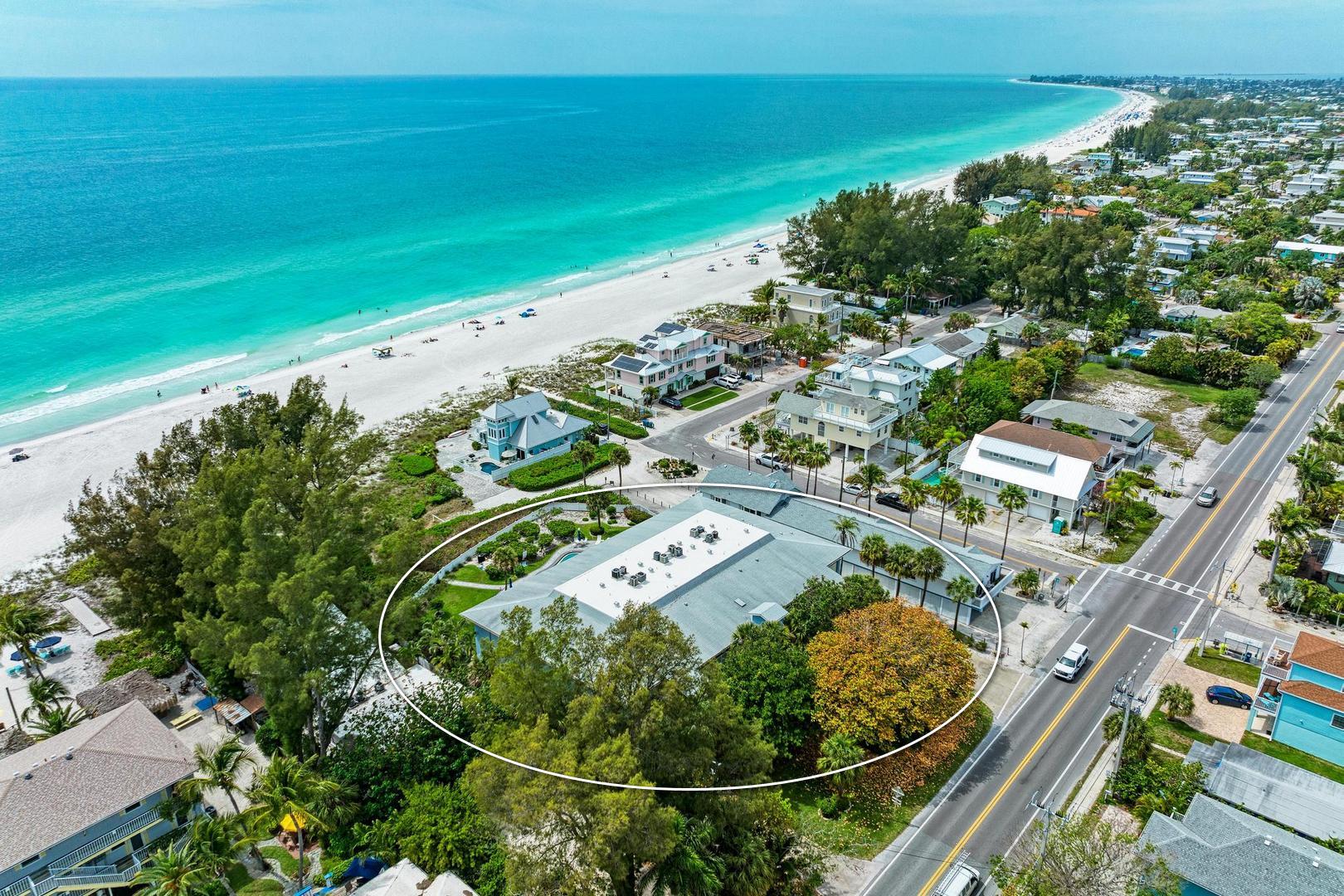 Aerial view of condo building for Sunset Beach 102 looking Northwest