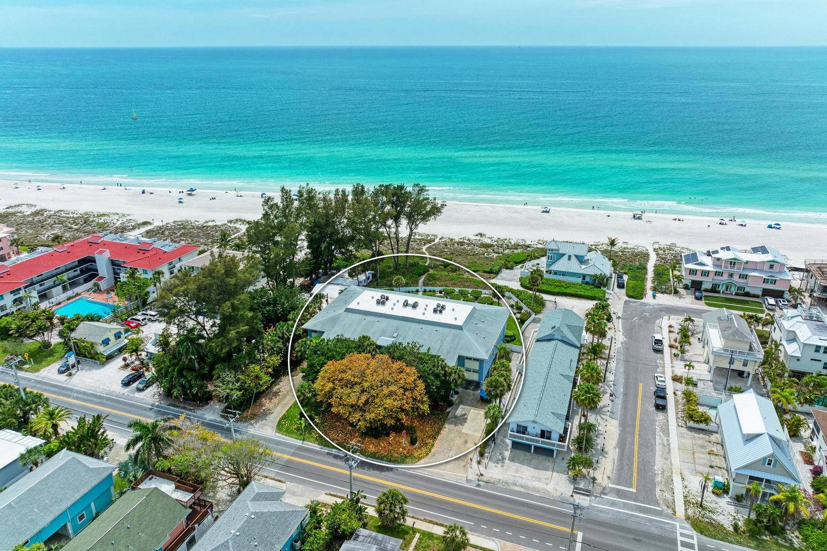 Aerial view of condo building for Sunset Beach 102 looking West