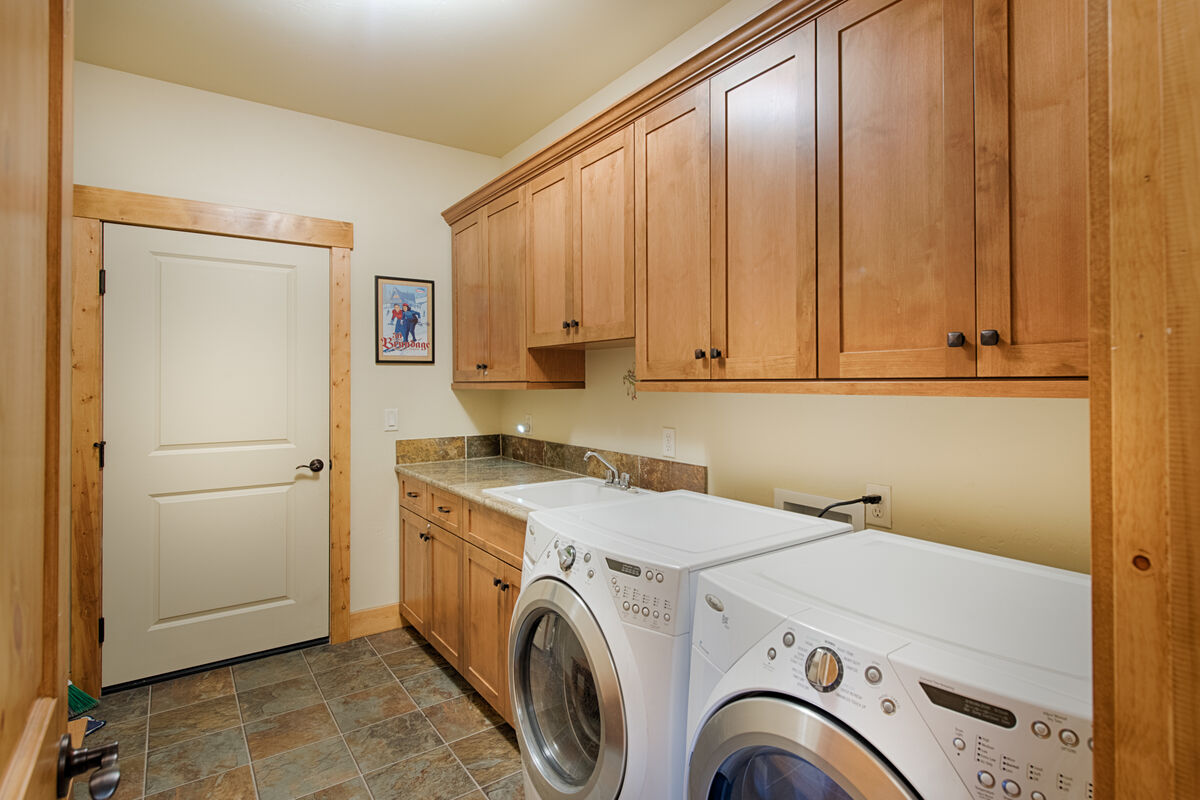 Full size laundry and utility room.
