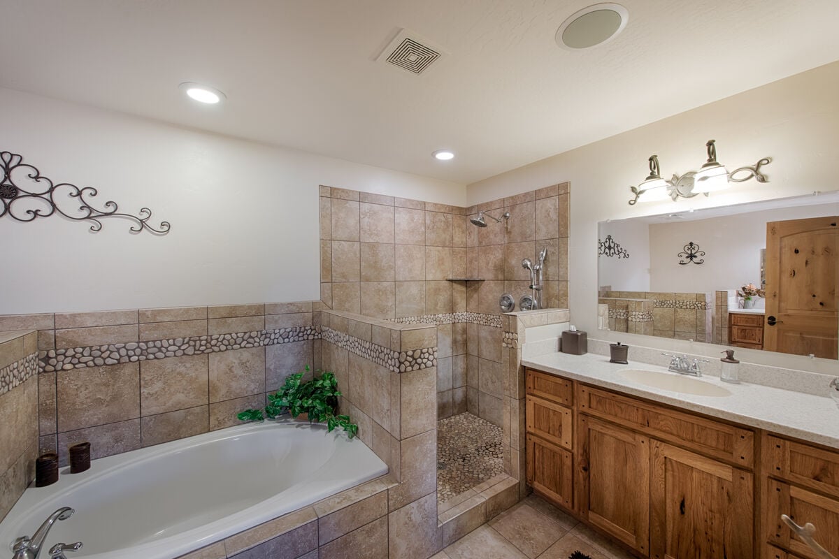 Walk in shower and large, soaking tub.