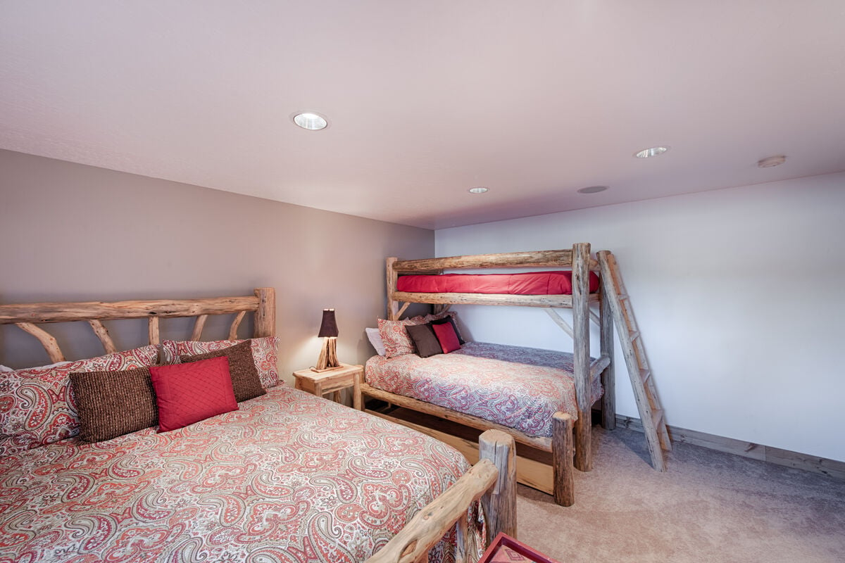 Lower level bedroom 3 with Queen bed and adult Twin/Queen bunk set.