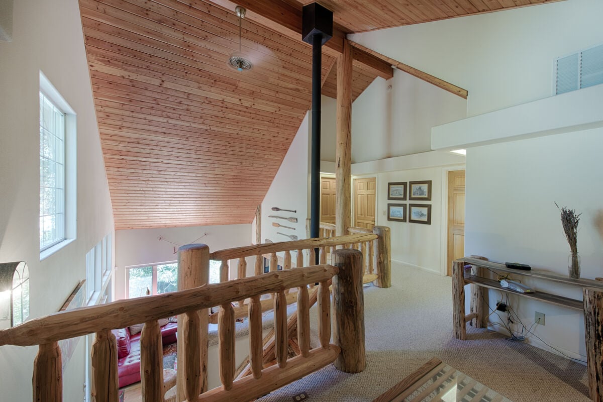 Upstairs has loft, two bedrooms and a guest bathroom.