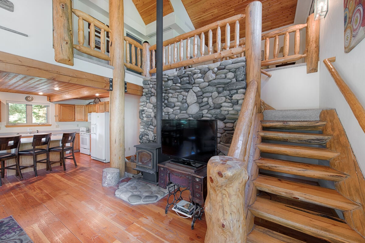 Wood burning stove, big screen TV.  Nicely crafted, log stairwell.