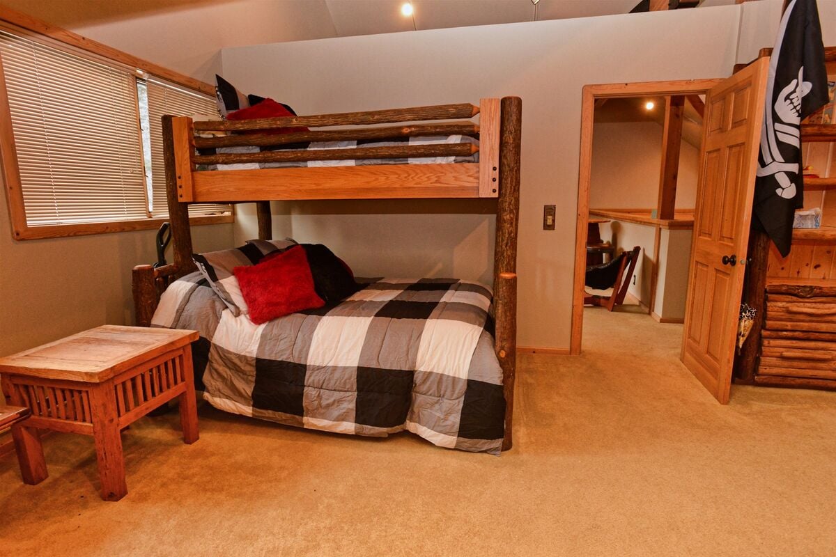 Second level bunk room off of loft has twin/full bunk set.