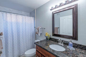 Bathroom 2 is upstairs and features a tub-shower combination.