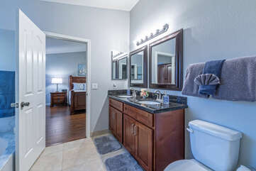 There are dual vanity sinks in the primary suite bath.