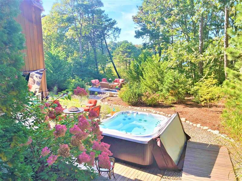 Hot tub with large flat screen TV and first of 2 fire pits -10 Cranberry Hollow Harwich-Cape Cod- New England Vacation Rentals-#BookNEVRDirectArtfulView