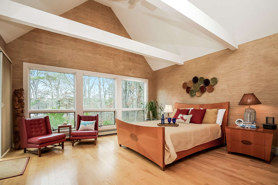 Bedroom #1 Queen bed with beautiful views of the pond, separate entrance to the deck, 2 occasional chairs to relax in-10 Cranberry Hollow Harwich-Cape Cod- New England Vacation Rentals-#BookNEVRDirectArtfulView