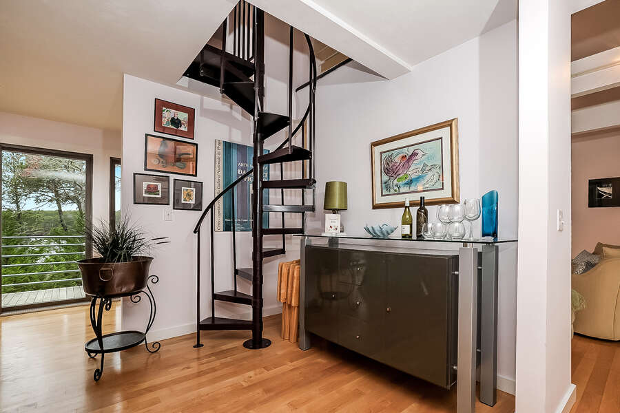 Enjoy creating your favorite cocktail at the dry bar and the spiral stairs to the loft bedroom-10 Cranberry Hollow Harwich-Cape Cod- New England Vacation Rentals-#BookNEVRDirectArtfulView