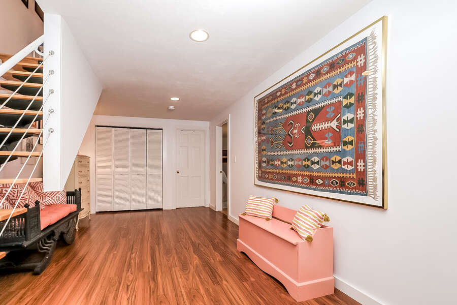 Finished basement hall way looking to bathroom #2 straight ahead and bedroom #2 on right-10 Cranberry Hollow Harwich-Cape Cod- New England Vacation Rentals-#BookNEVRDirectArtfulView