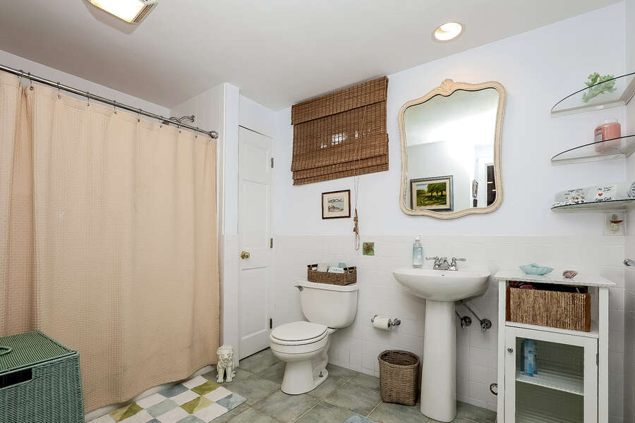 Bathroom #2 Full tub shower combination at end of lower level hallway -10 Cranberry Hollow Harwich-Cape Cod- New England Vacation Rentals-#BookNEVRDirectArtfulView