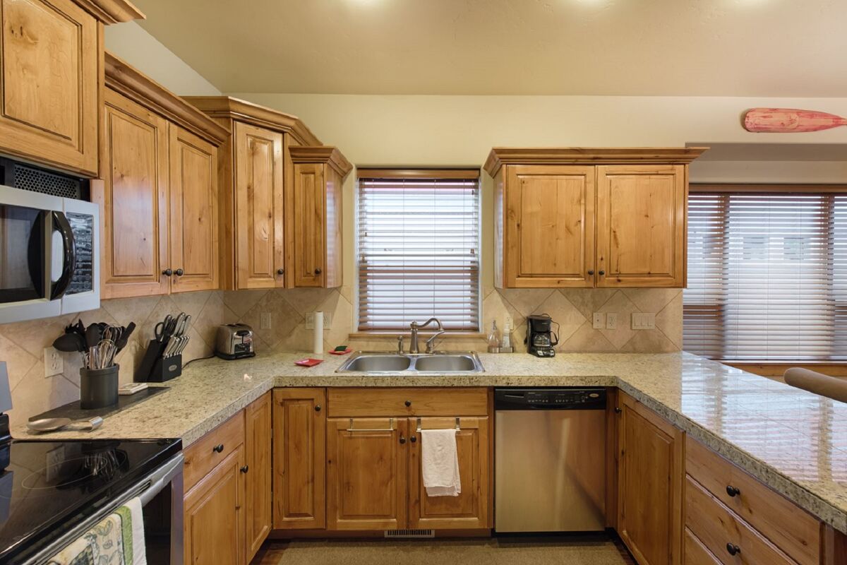 Efficient and well equipped kitchen with nice prep space.