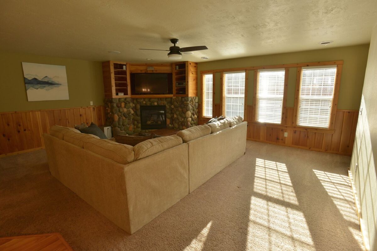 Bright space with comfy furnishings.  Stone hearth and propane fireplace.