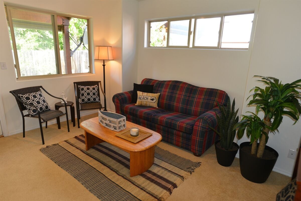 Downstairs lounge has sofa bed, hall access bathroom and patio access.
