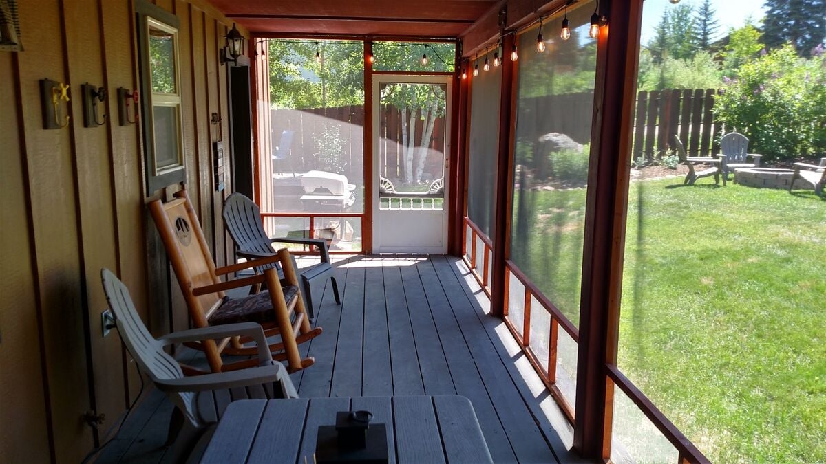 Lounge in cool shade on the screened porch.
