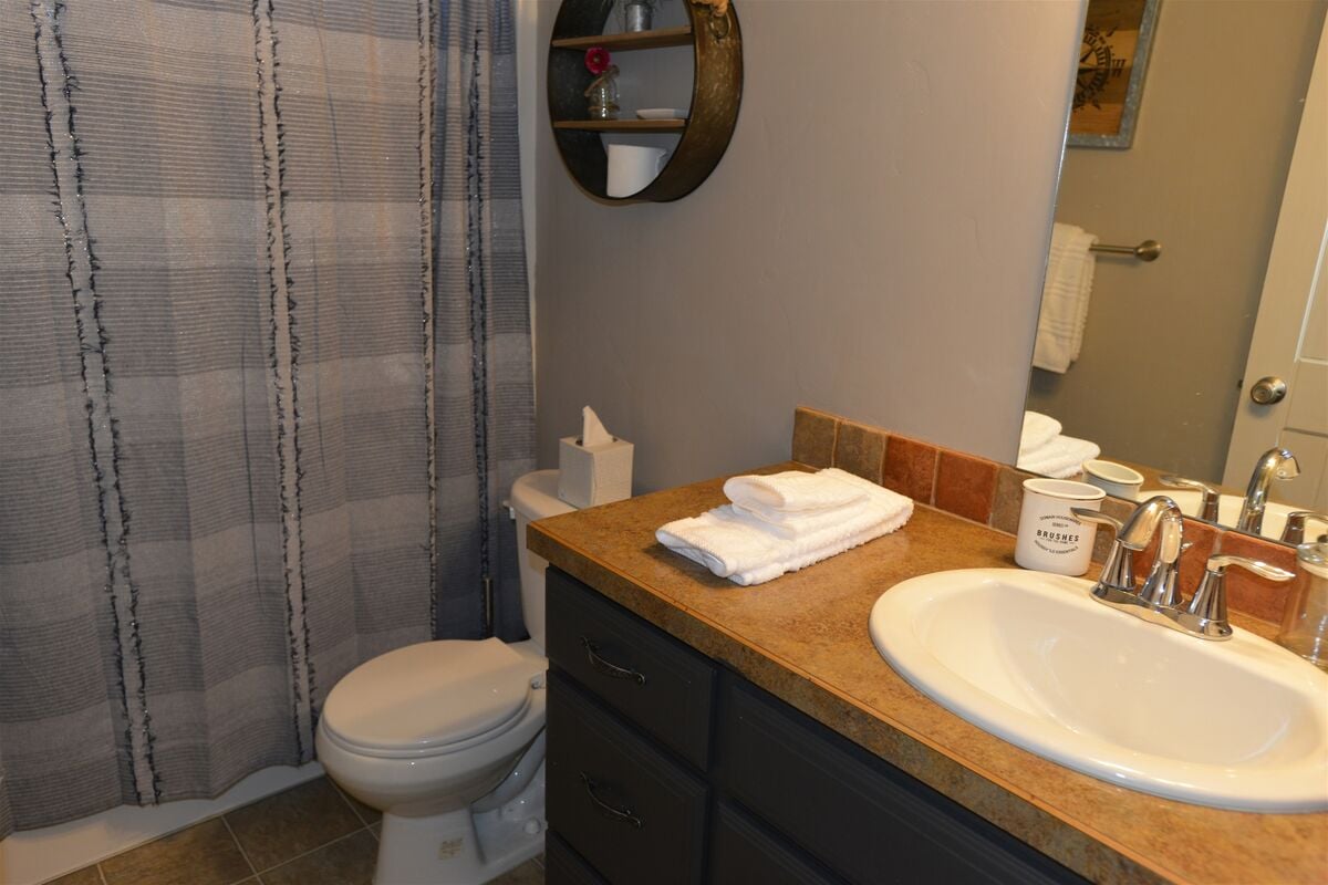 Upstairs guest bath has hall access.
