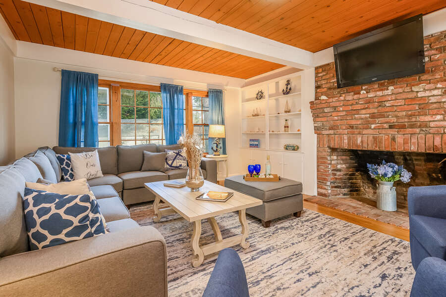 Living room with TV over fireplace - 2 Cove Road Harwich Cape Cod - New England Vacation Rentals- #BookNEVRDirectCozyCove