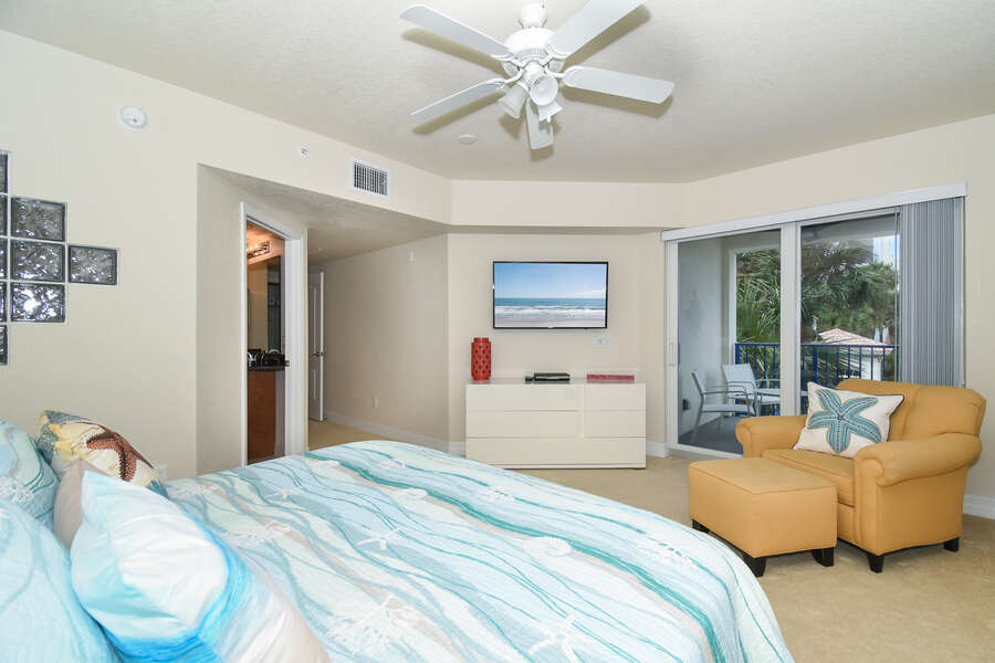 Large bedroom with mounted TV