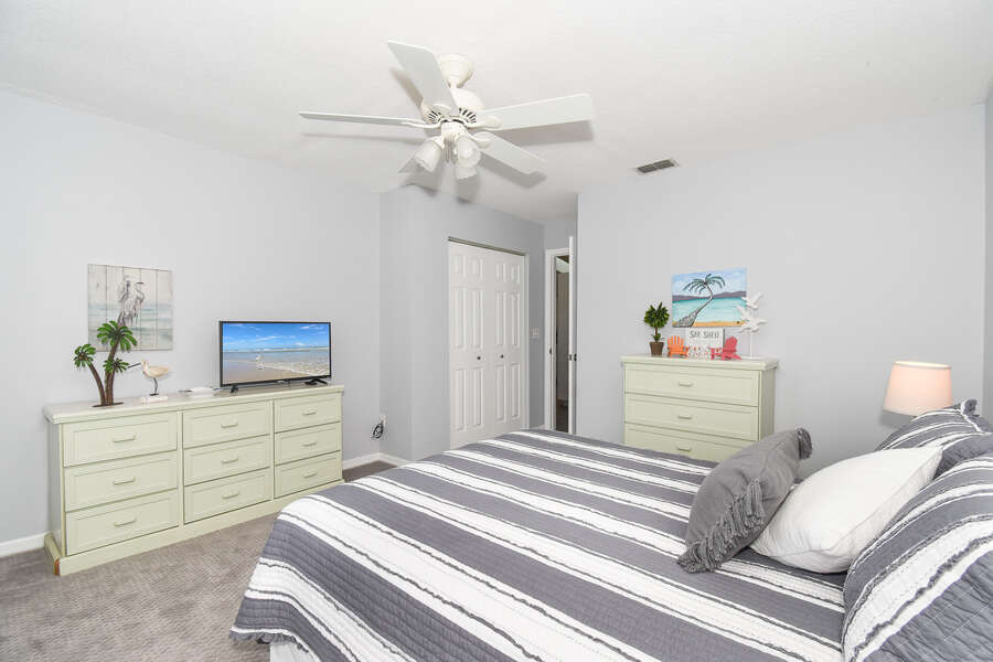 another spacious bedroom with tv in new smyrna beach home rental