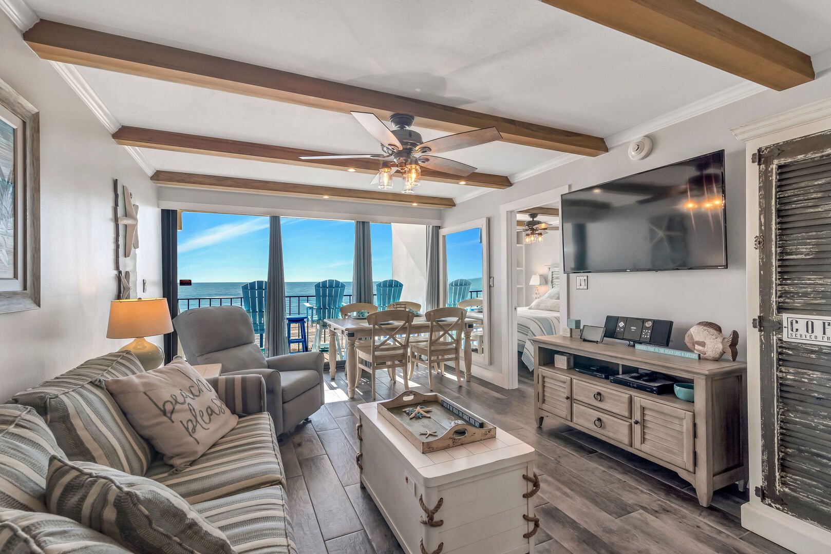 Open Plan Living Area with Comfortable Queen Size Sleeper Sofa with Sweeping Floor to Ceiling Views of the Gulf of Mexico