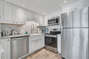Fully Equipped Upgraded Kitchen with Quartz Countertops and Stainless Steel Appliances