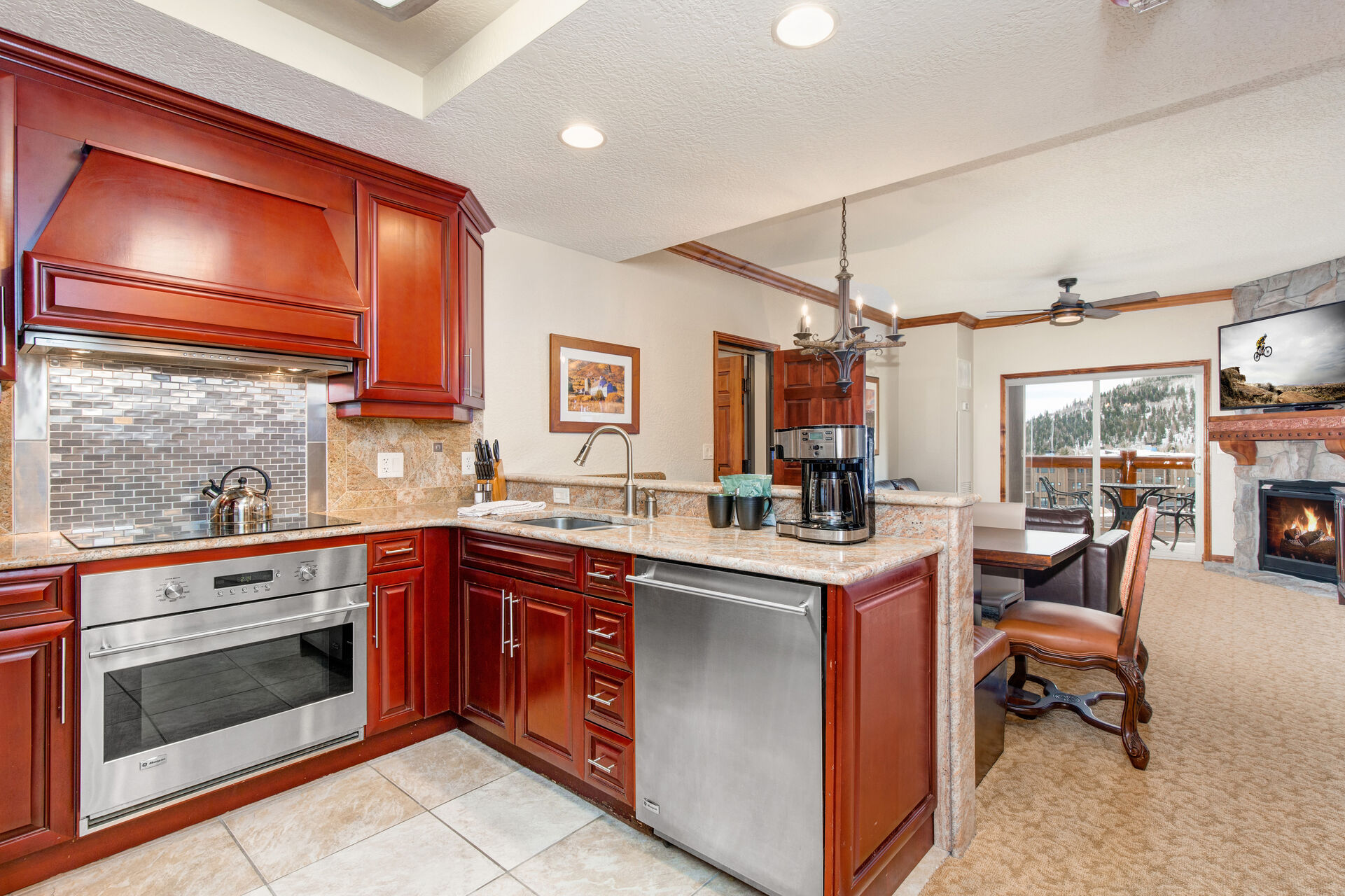 Side A Fully Equipped Kitchen with stone countertops, stainless steel appliances, and ice maker