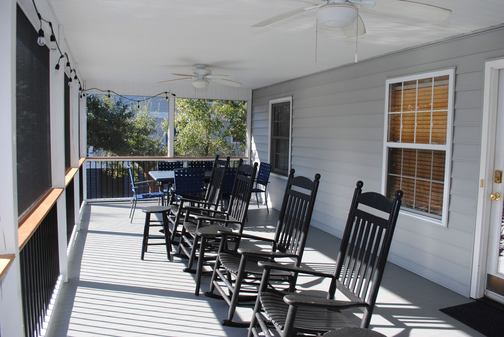 Screened Porch with Rockers and Dining Area