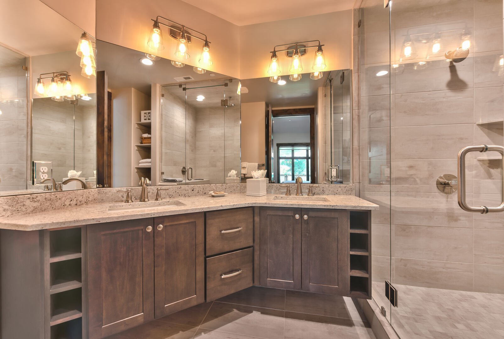 Bathrooms feature dual bowls, natural stone