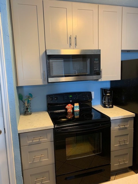 THIS FULLY STOCKED KITCHEN INCLUDES A LARGE FOOD PANTRY, FULL SIZE APPLIANCES AND MICROWAVE