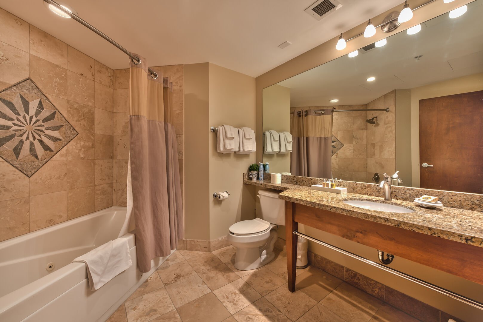 Superior bath w/ heated floors, jacuzzi tub, granite, natural stone