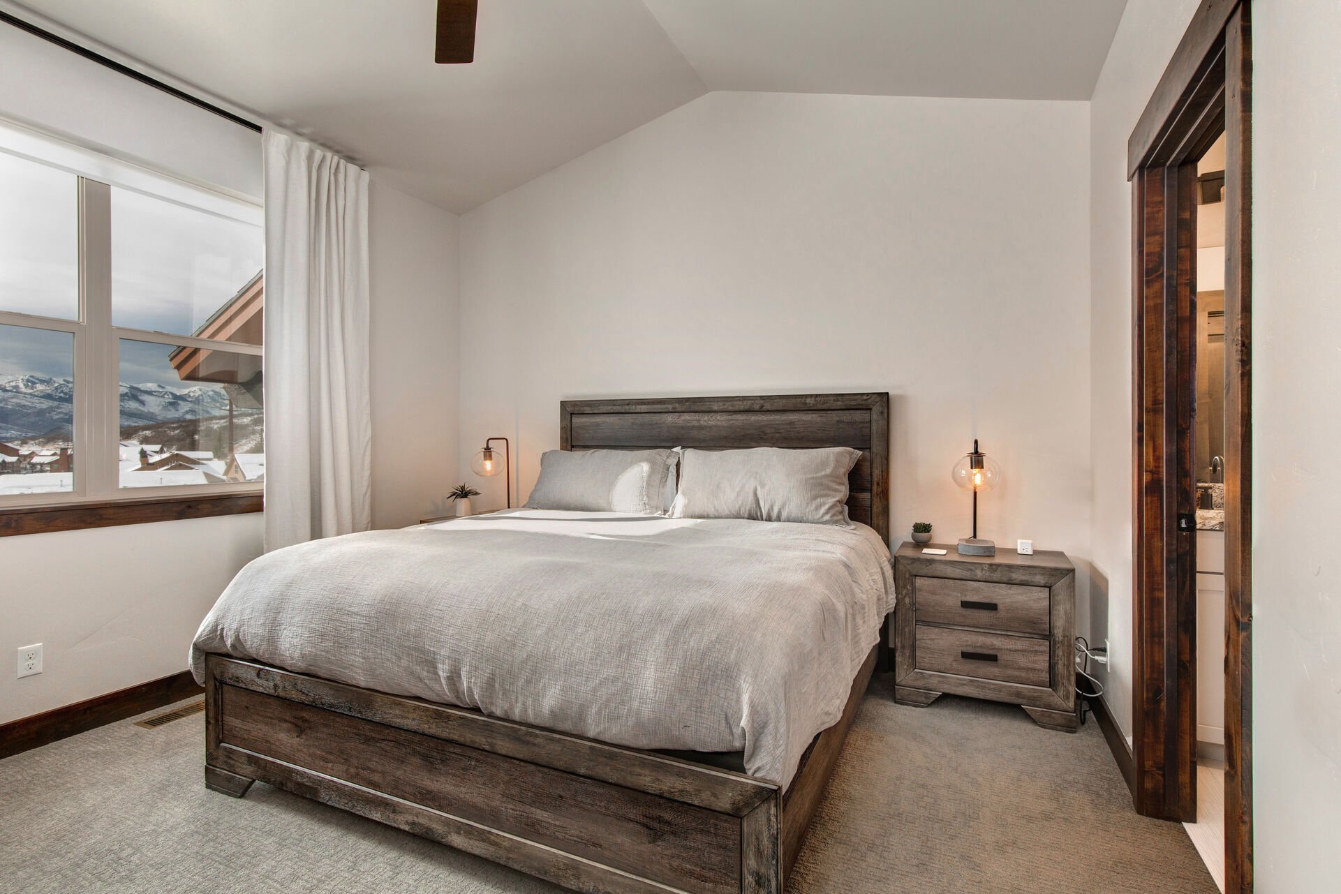 Main Level Grand Master Bedroom with a King Bed and Mountain Views