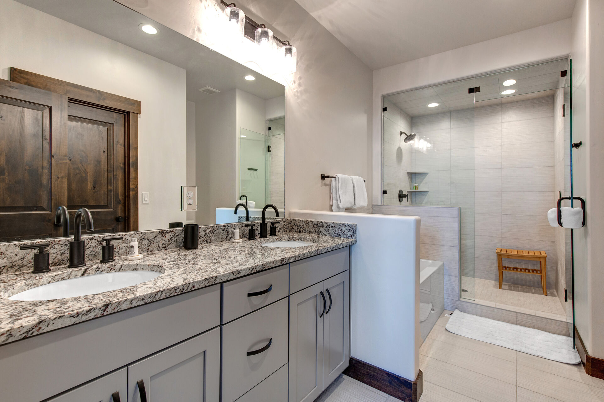 Grand Master Bath with Dual Stone Counter Sinks, a Soaking Tub and Shower