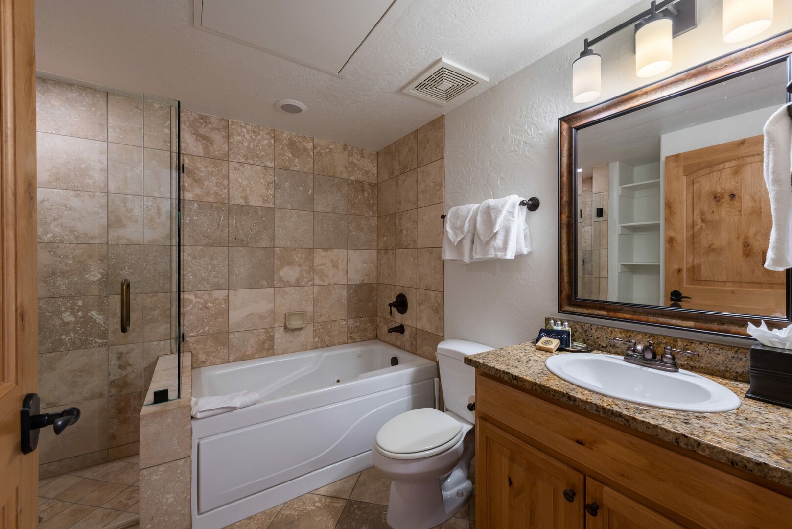 Second master suite bathroom with step in shower and jacuzzi tub