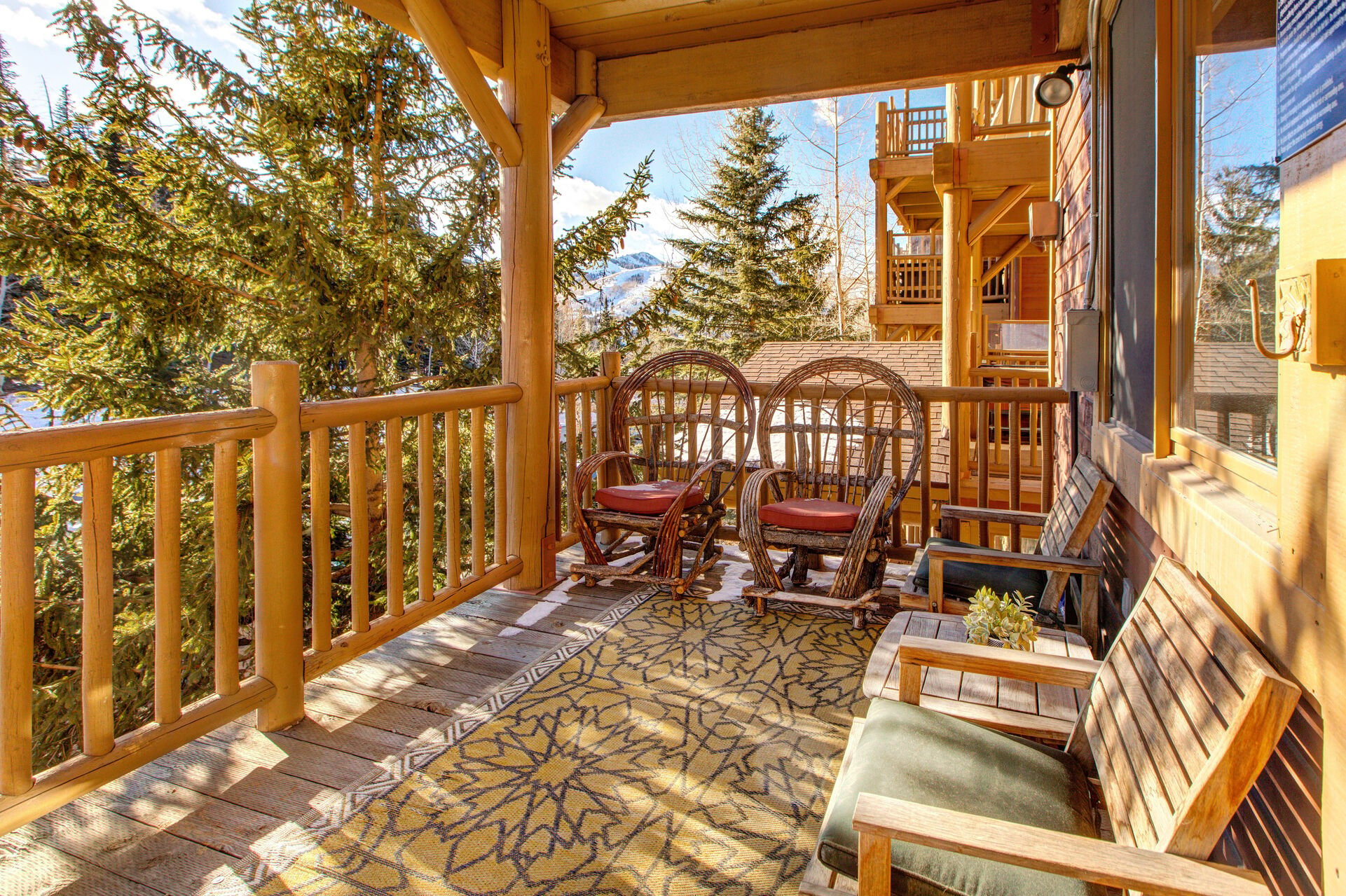 Private Patio located off Living Room with private hot tub, seating for four, and breathtaking views of the surrounding area