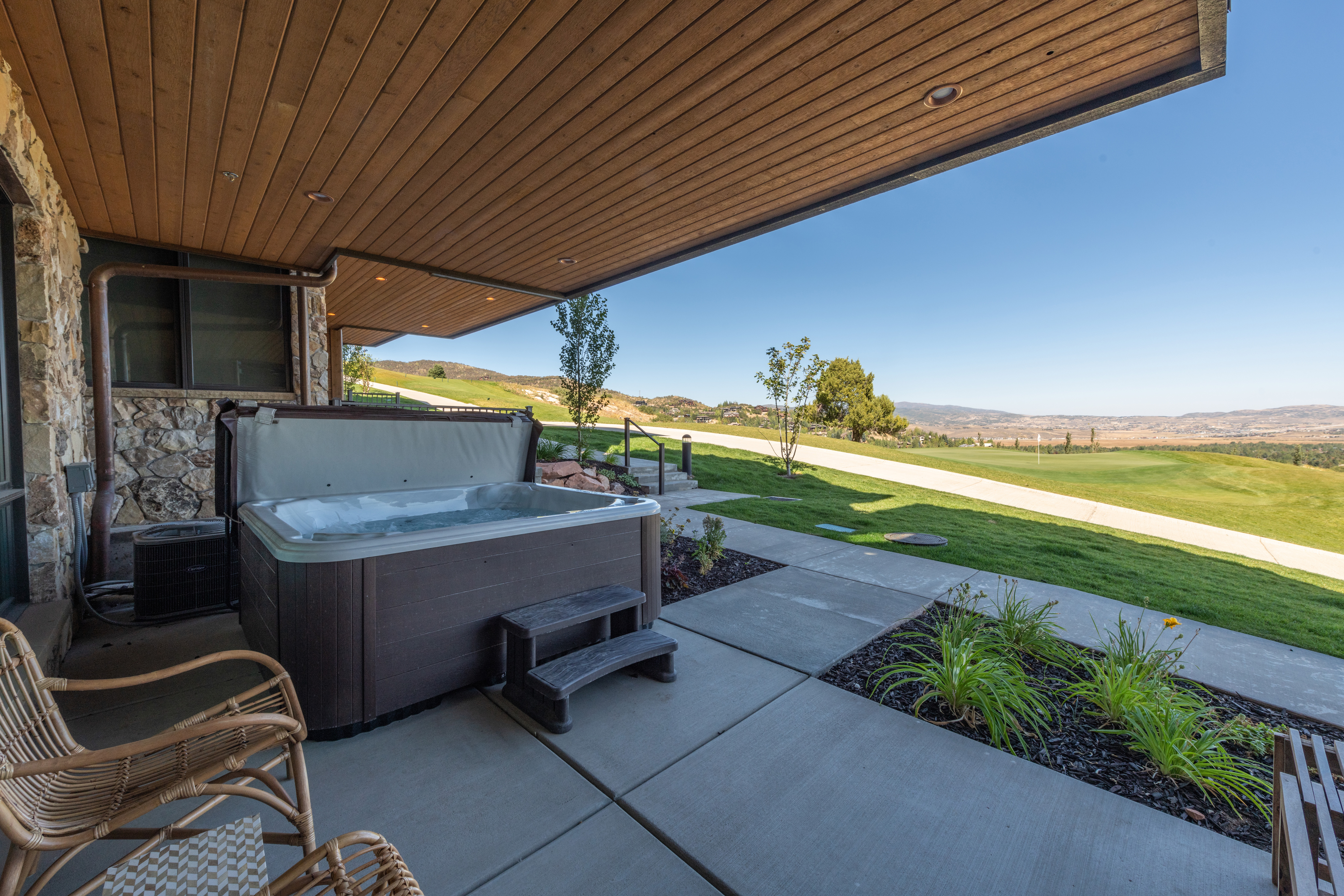 Outside the second living area is the patio, private hot tub, walking paths and golf course