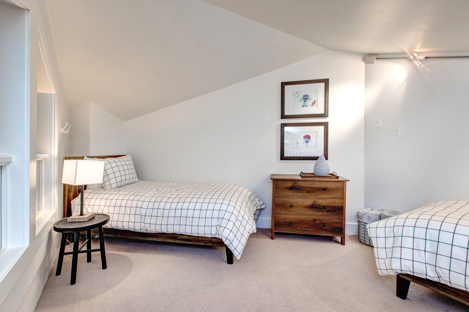 Located at the top of the spiral staircase is the homes' loft with two twin beds