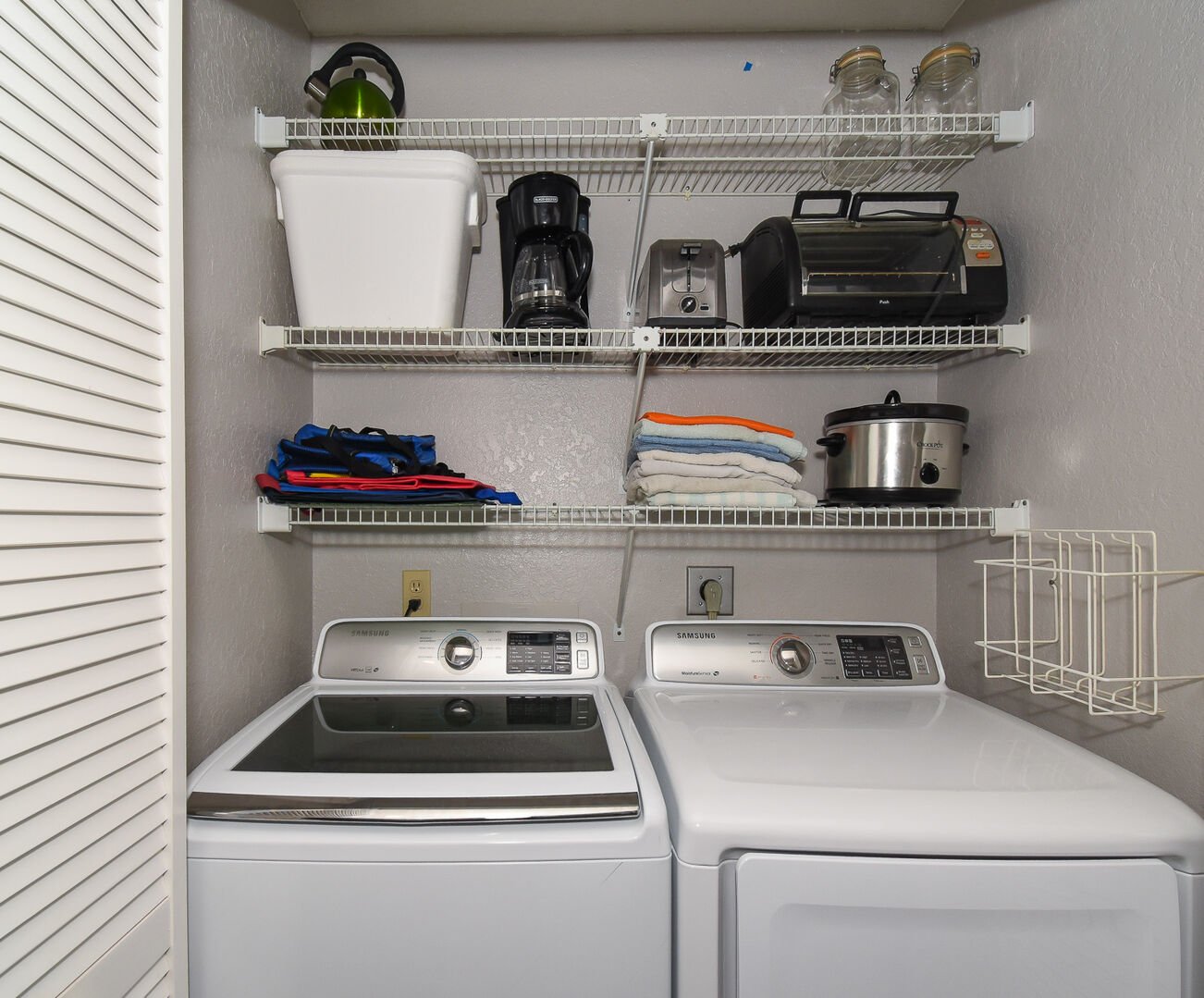 laundry room and storage inside condo