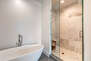 Large Soaking Tub and Tile/Glass Shower with Multiple Shower Heads