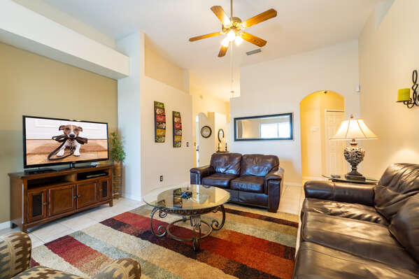 Family seating area with large flatscreen TV and leather seating