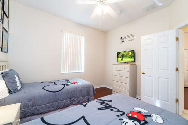 Bedroom 3 has twin beds, closet, flatscreen TV and famous mouse theme