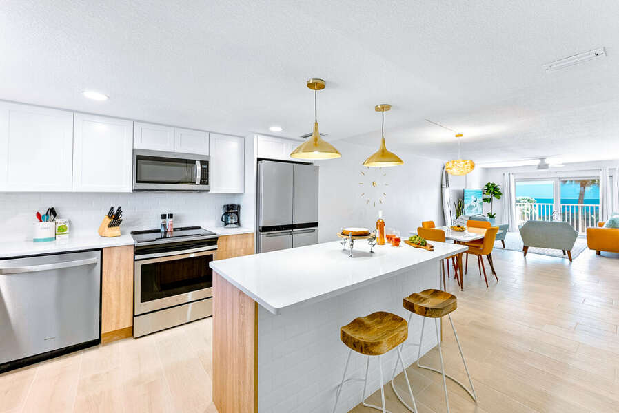 Sleek, contemporary kitchen with stainless steel appliances and a spacious island