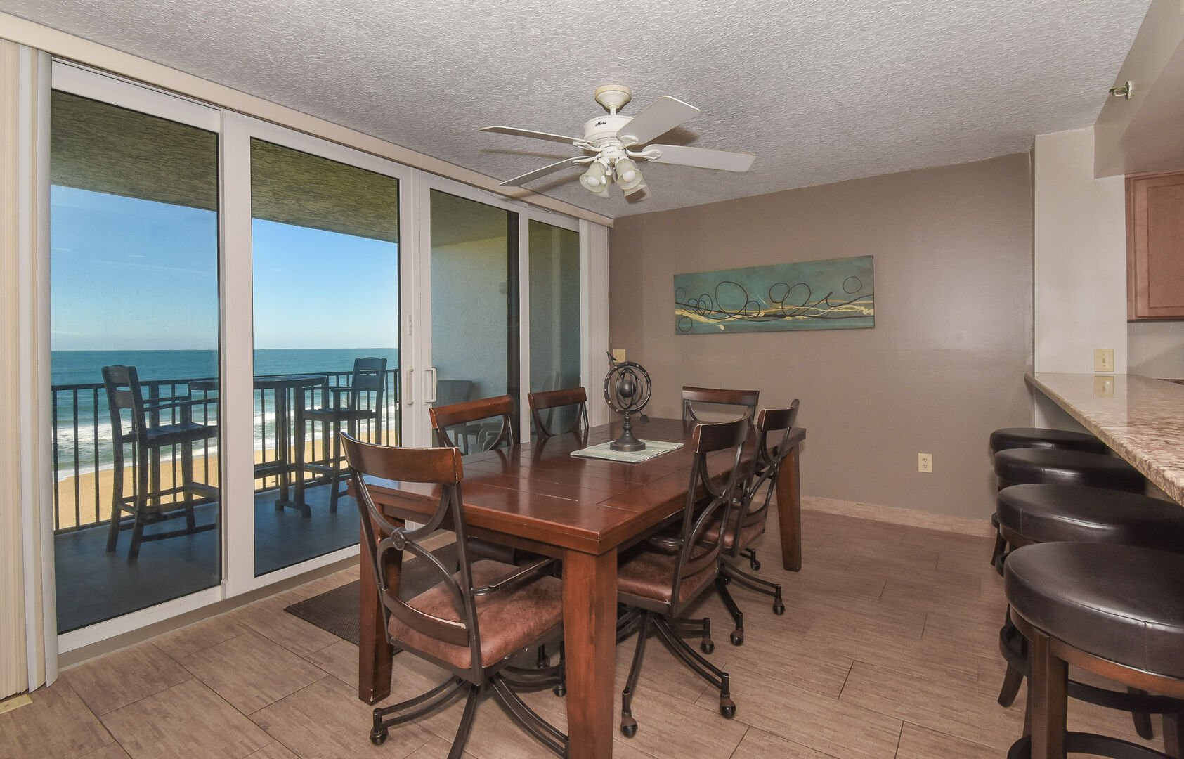 dining room table and dining area with balcony access