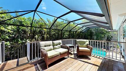 Beautiful open airy deck space and screened in pool cage