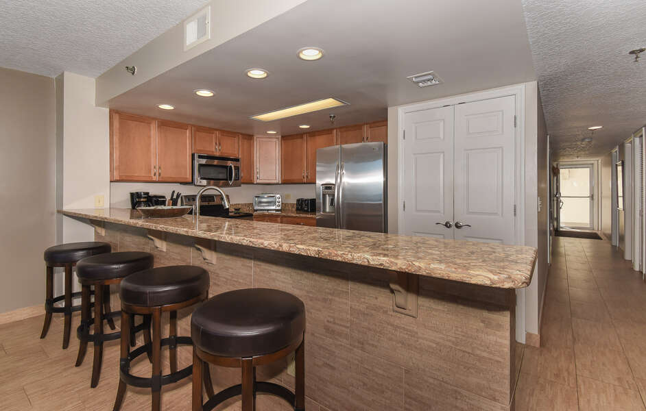 large kitchen with modern appliances in this new smyrna beach vacation rental