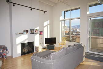 Living Room in Market Street Lofts with Gas Fireplace, TV, and views